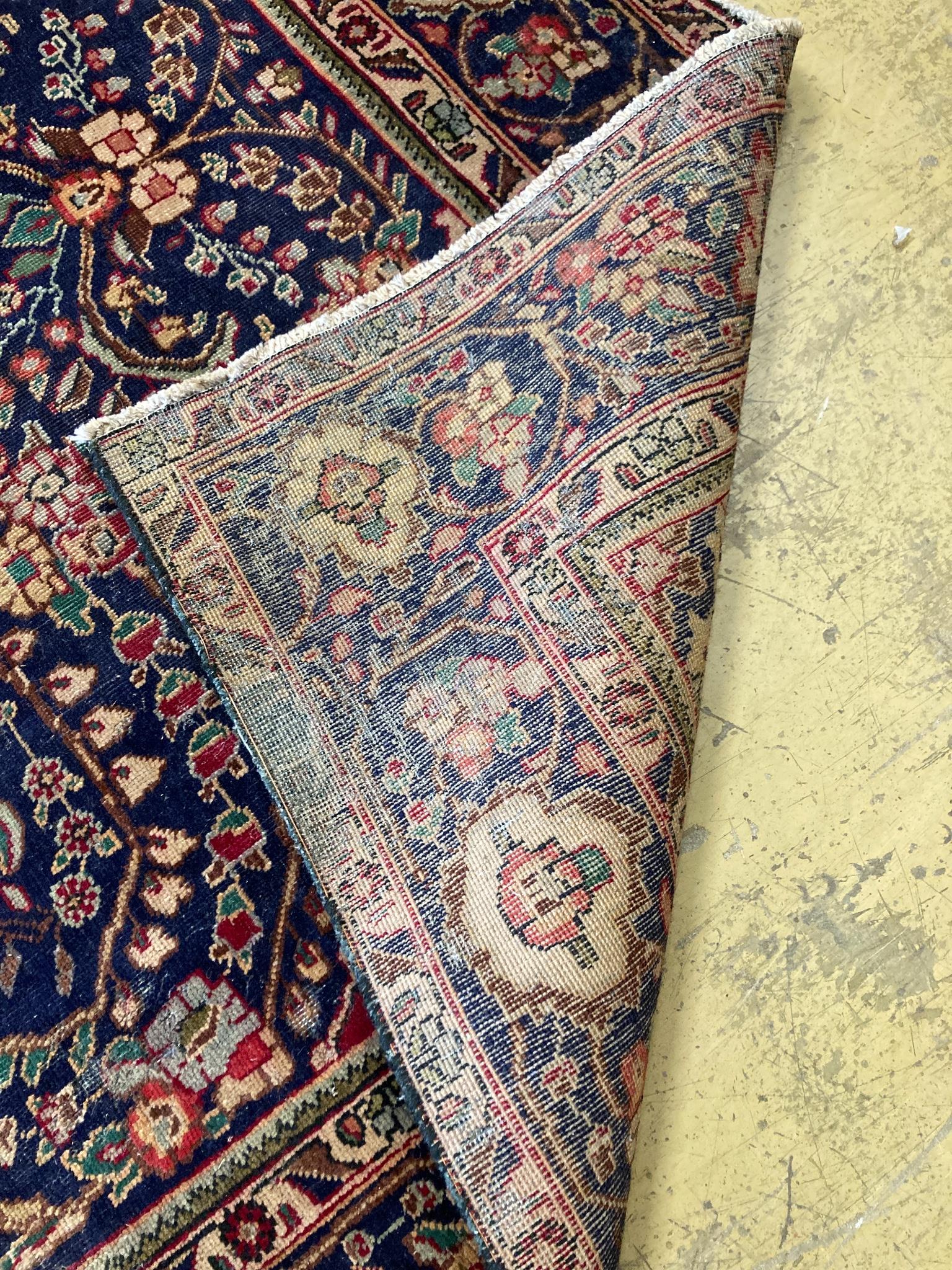 A North West Persian design blue ground carpet, 284 x 196cm